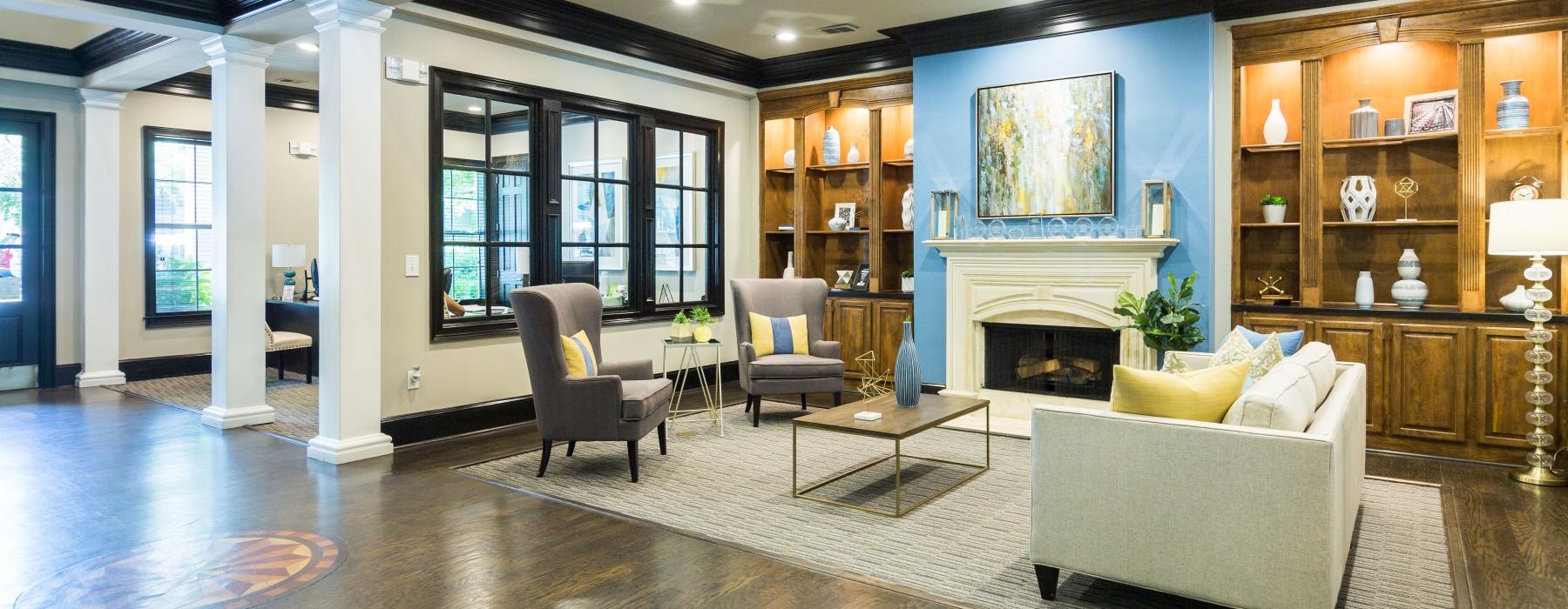 a large living room with a fireplace