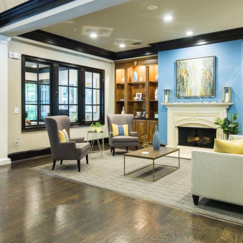 a large living room with a fireplace