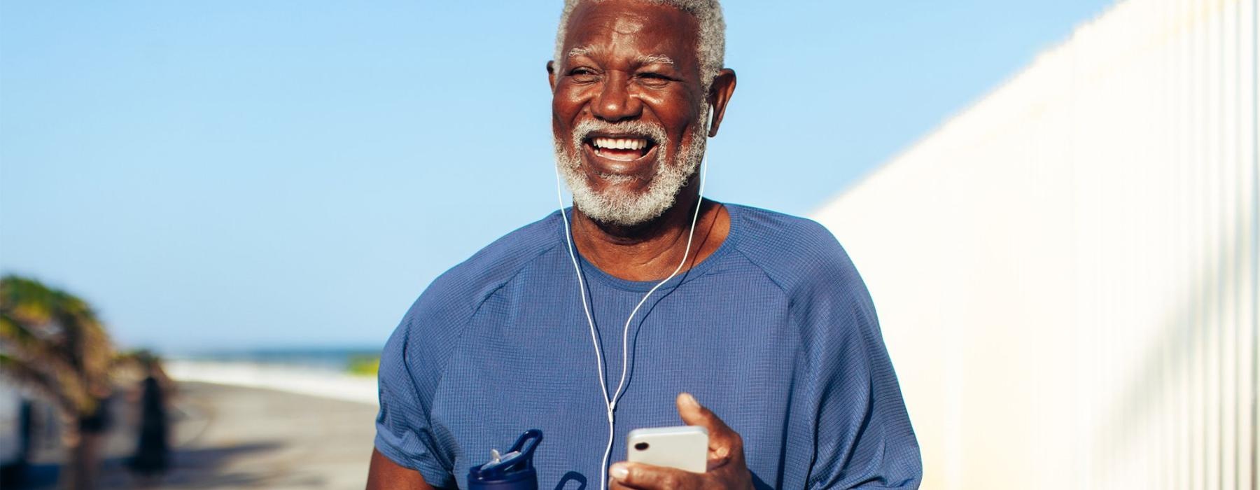 a man holding a water bottle while outdoors
