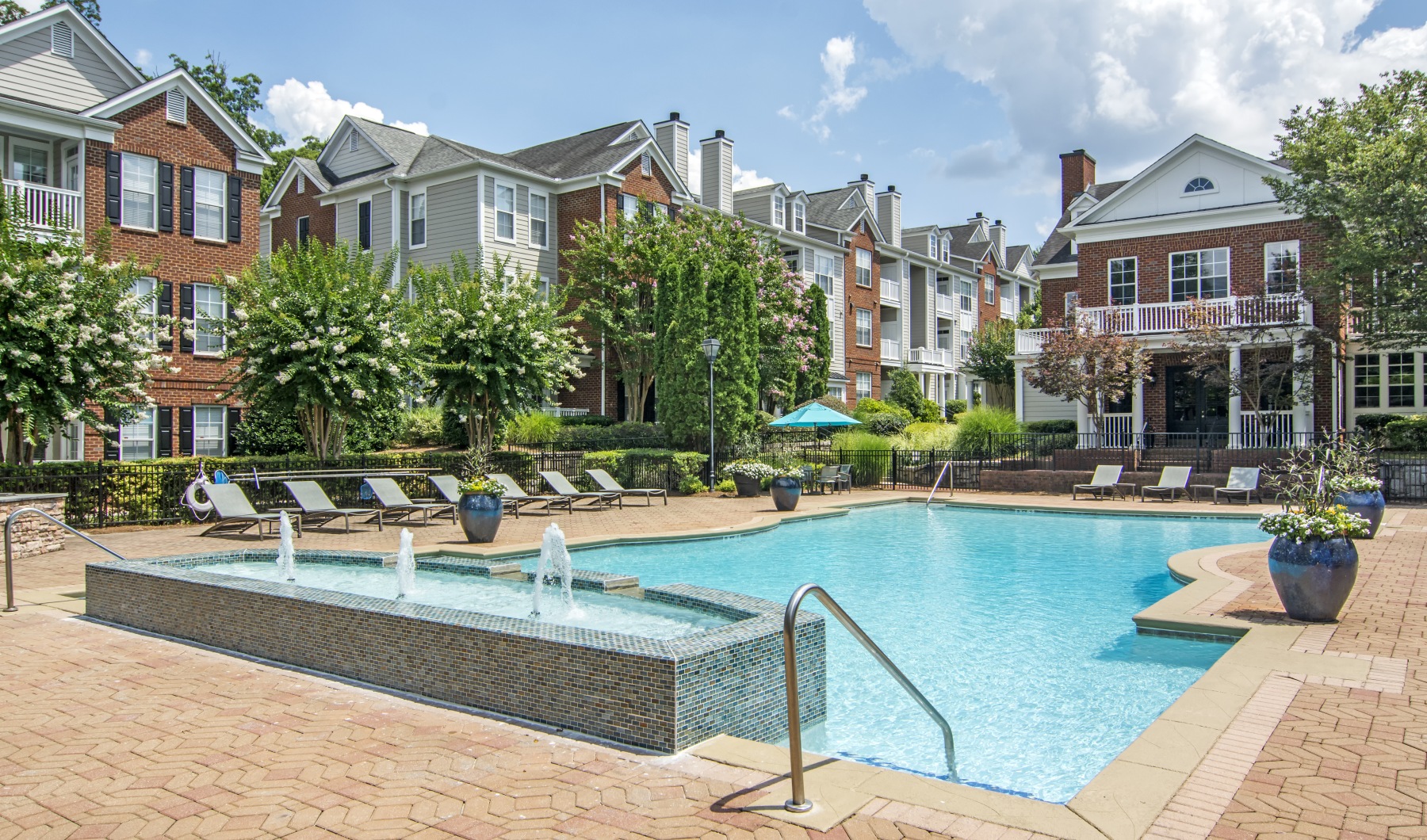 a pool with buildings behind it